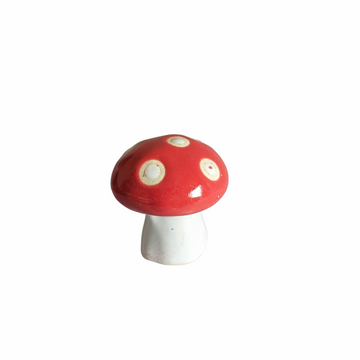 Green spotted mushroom figure for garden